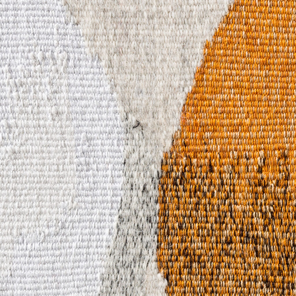 The picture shows a close-up of the surface of the tapestry.