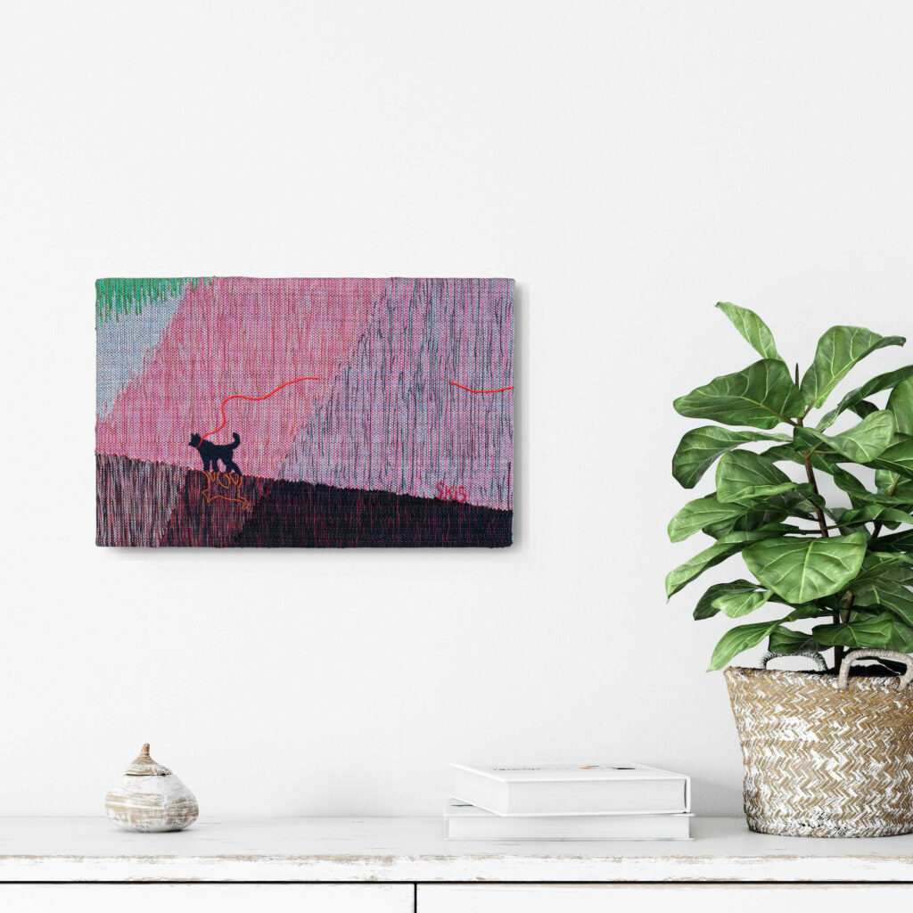 A textile artwork in the interior.