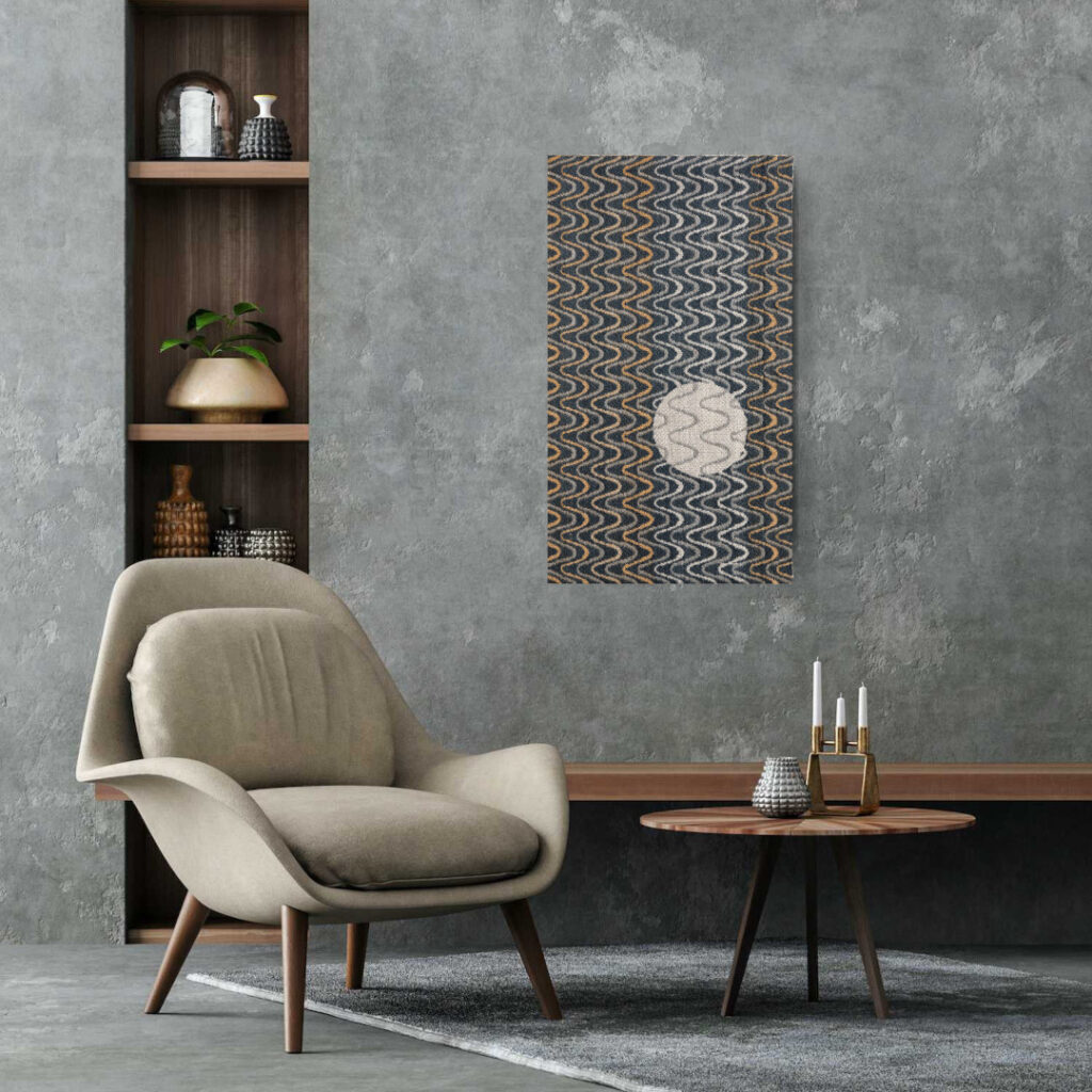The photo shows a graphite-colored artwork hung in the living room.