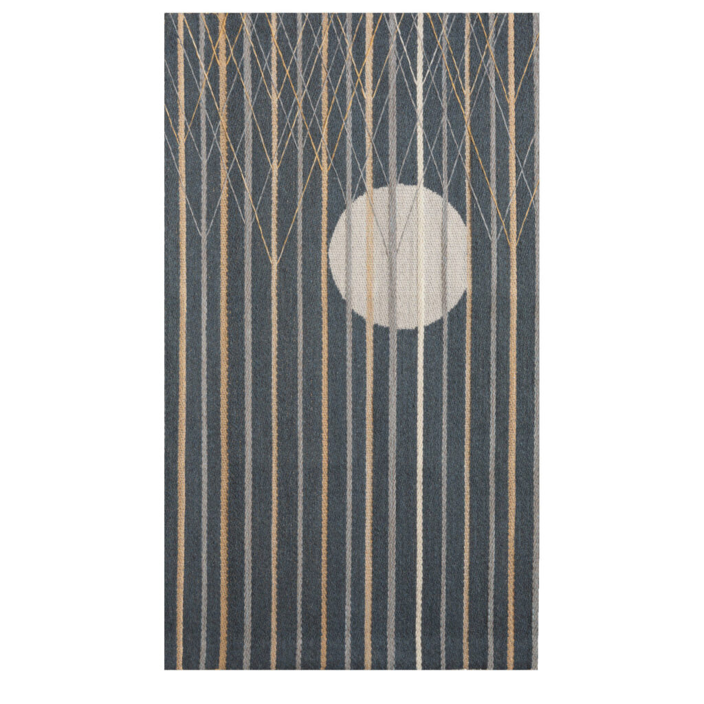 The picture shows a woven artwork depicting the moon rising from behind the forest.